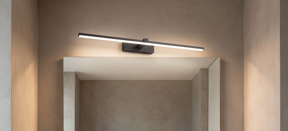 Ellery matte black vanity light above a bathroom mirror