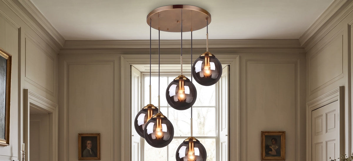 Hartley smoked glass cascade chandelier above a round dining table