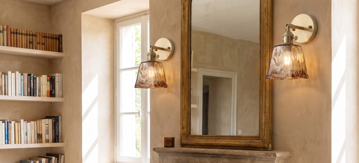 Amberley amber glass wall lights either side of a fireplace mirror