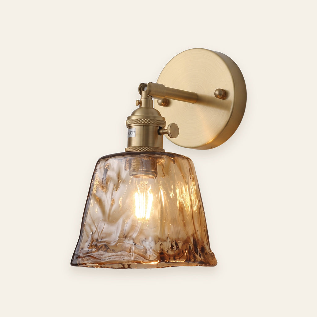 Amberley amber glass wall light with brass arm, cream background