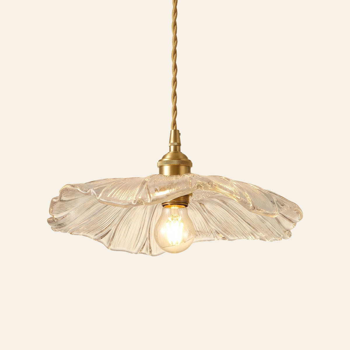 Benhall 28 cm sunflower glass pendant light in clear glass with a wavy petal edge, cream background