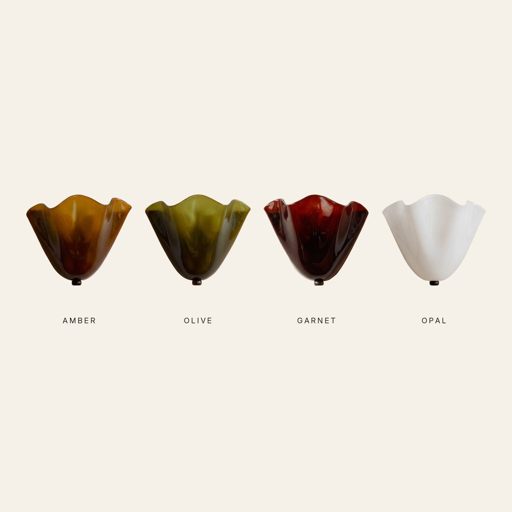 The Blythburgh wall light in amber, olive, garnet and opal glass side by side