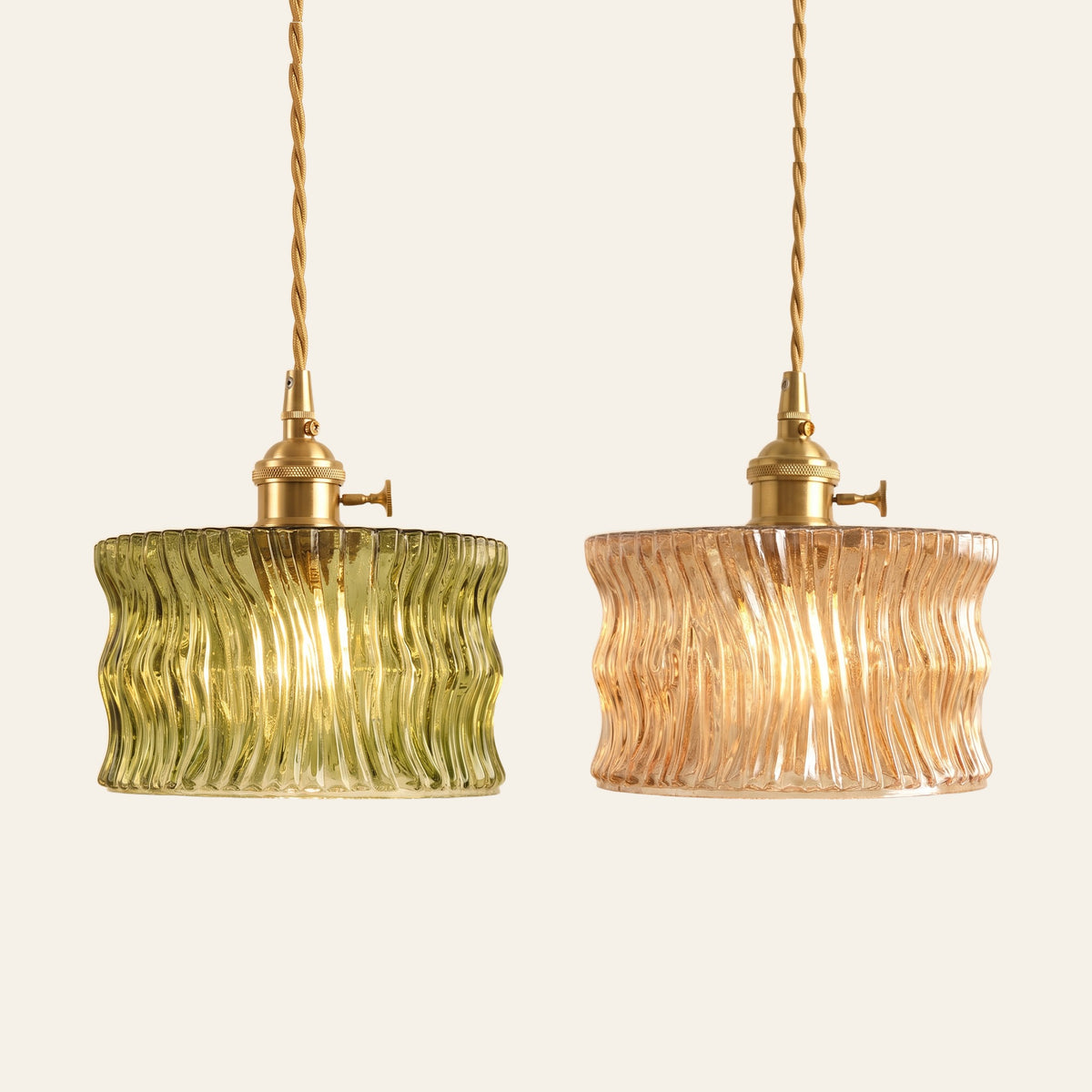 Boxford wavy ribbed glass pendant lights in green and amber side by side
