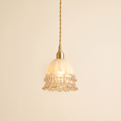 Bramfield pendant light with a milky fluted glass bell, beaded band and clear ruffled rim on a brass holder, cream background