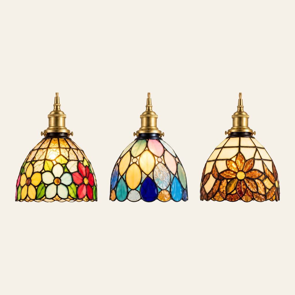 The Bures pendant in its three designs: floral, teardrop and sunflower