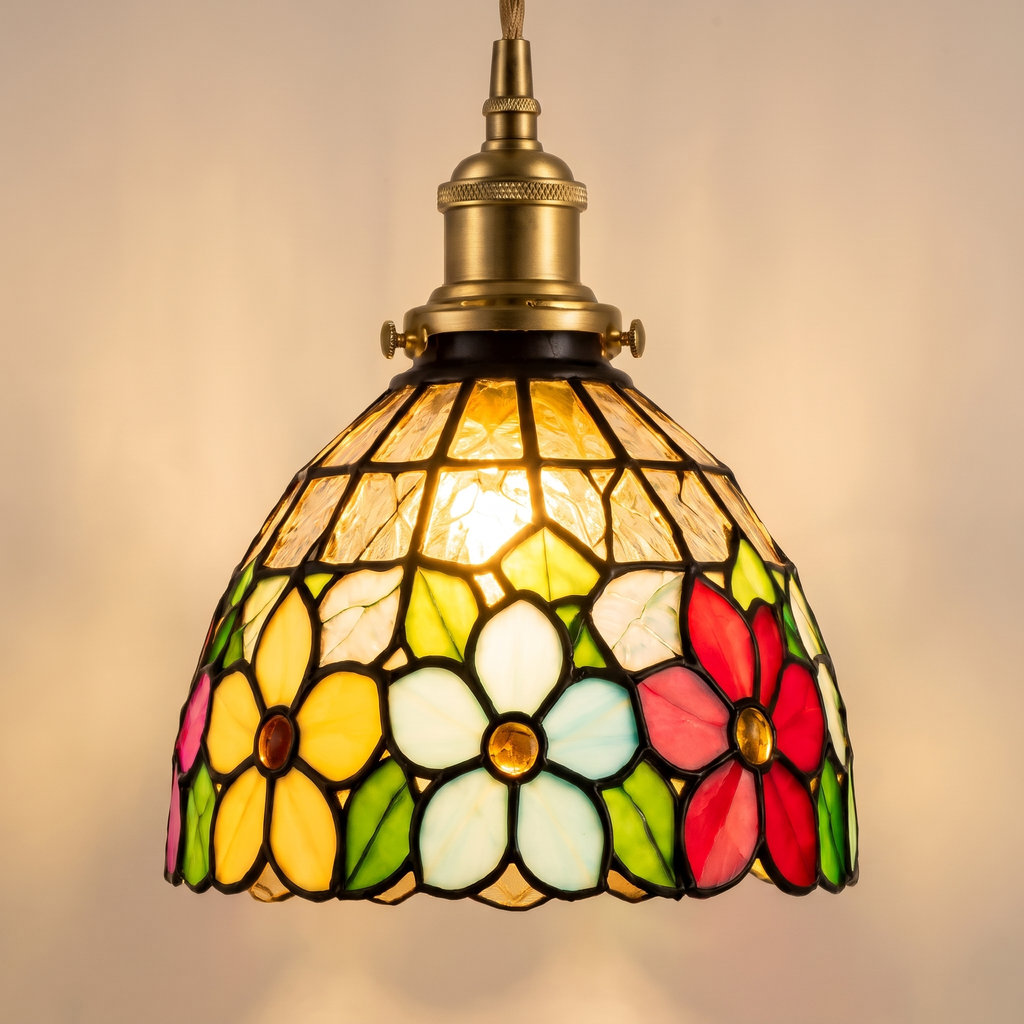Close up of the Bures floral stained glass shade, lit