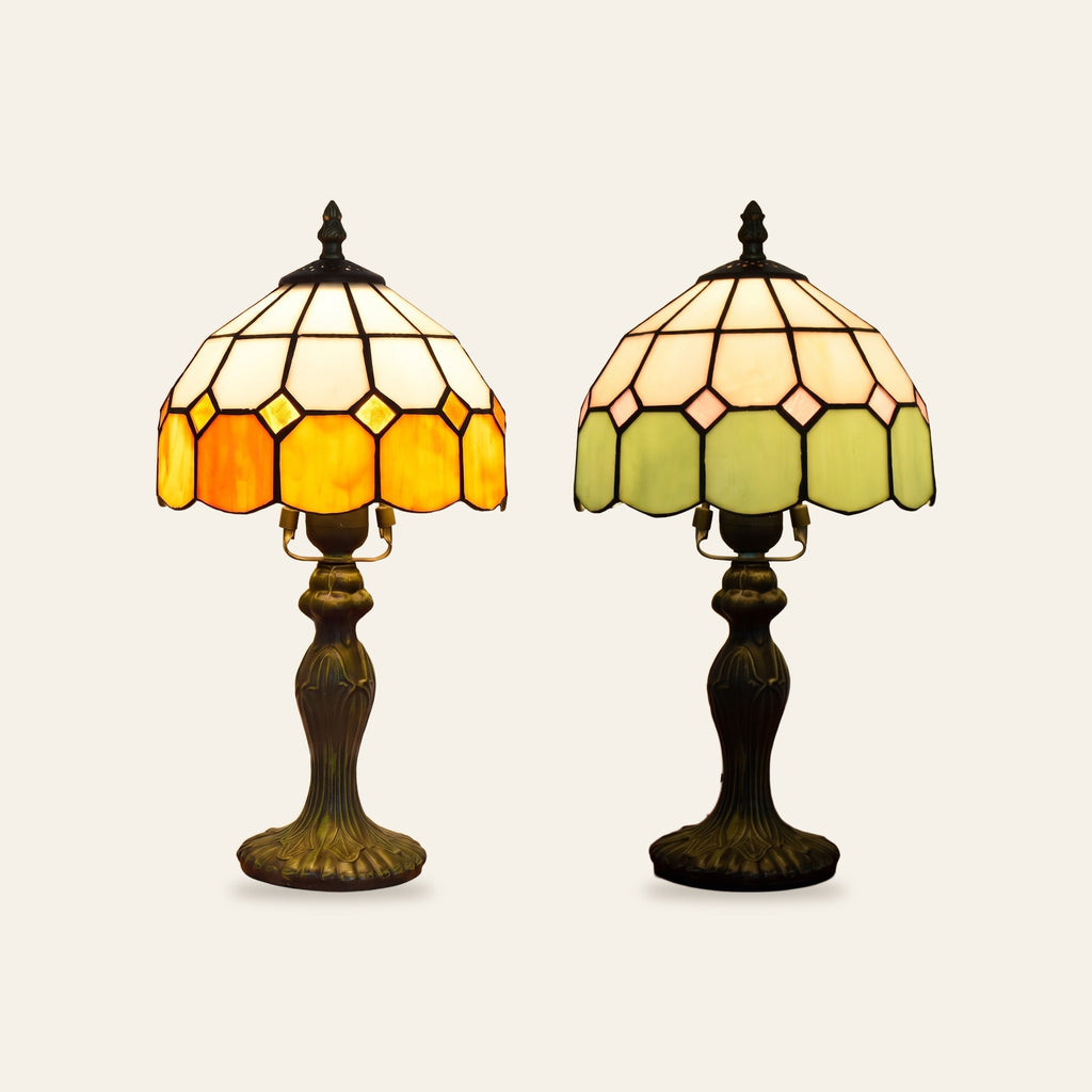 Cavendish stained glass table lamps in amber and green side by side