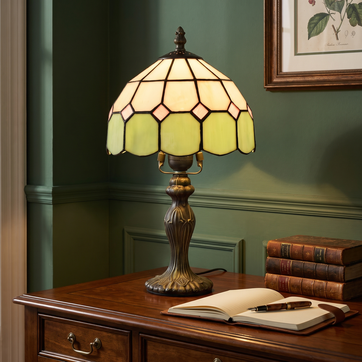 Green Cavendish stained glass lamp lit on a mahogany desk against a green panelled wall
