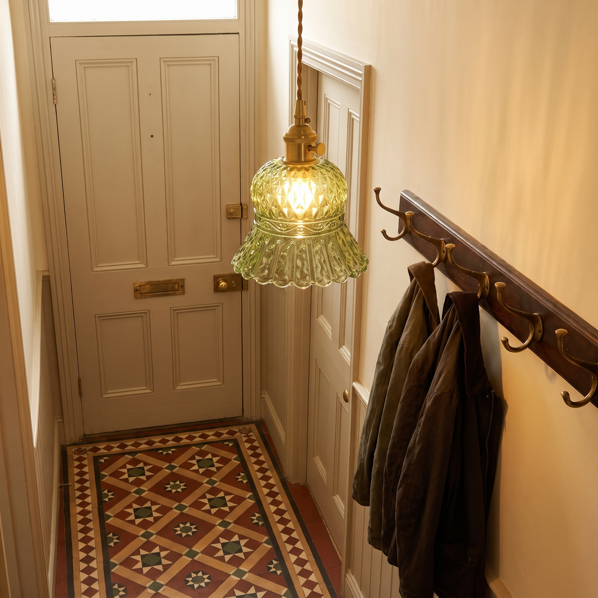 Green Cratfield pendant lit in a Victorian hallway with a tiled floor