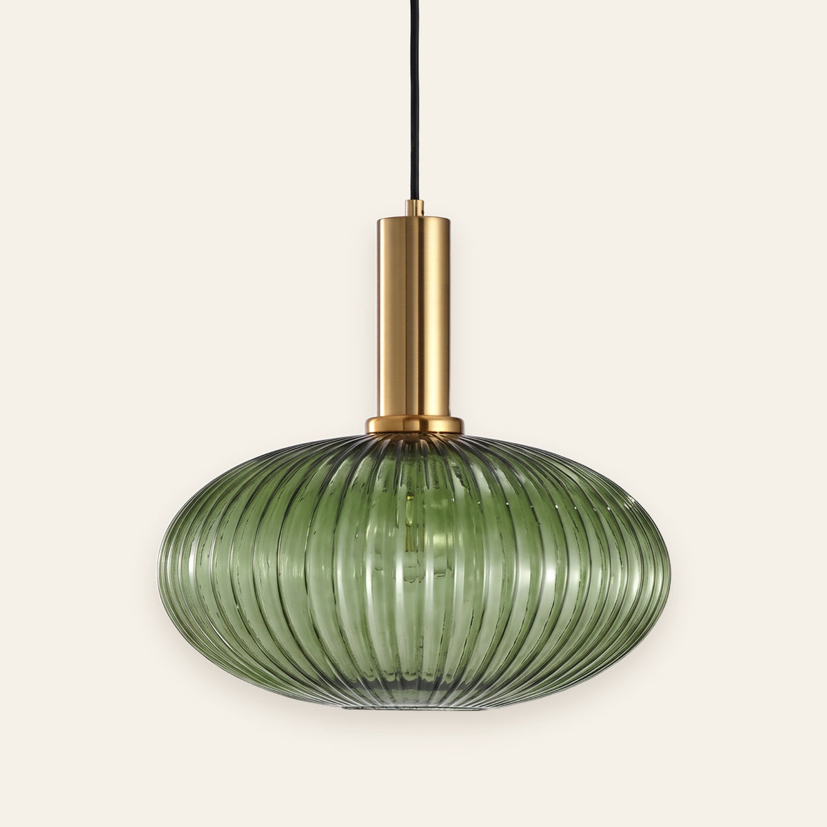 Fenwick green ribbed glass pendant with brass cap, cream background