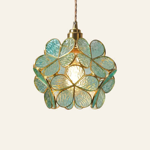 Fressingfield pendant light, a round ball of aqua rippled glass flowers in fine gold tone frames, lit, cream background