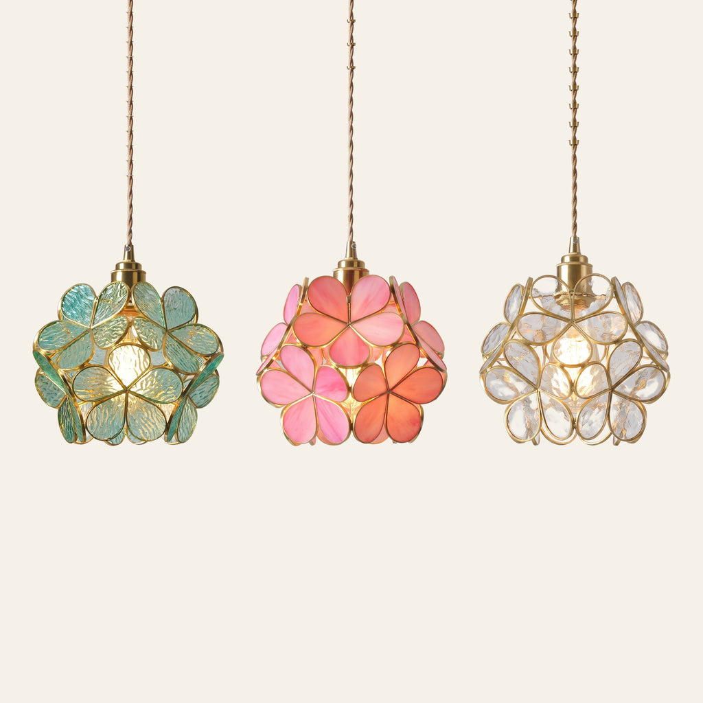 The Fressingfield glass flower pendant light in aqua, pink and clear side by side