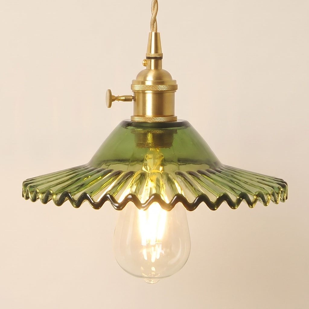Close up of the lit green Glemsford shade: fine flutes running out to a crimped edge above the bulb