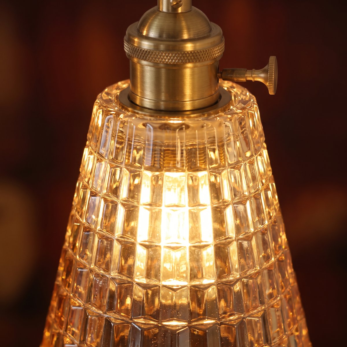 Close up of a lit Hacheston shade showing the faceted amber cut glass