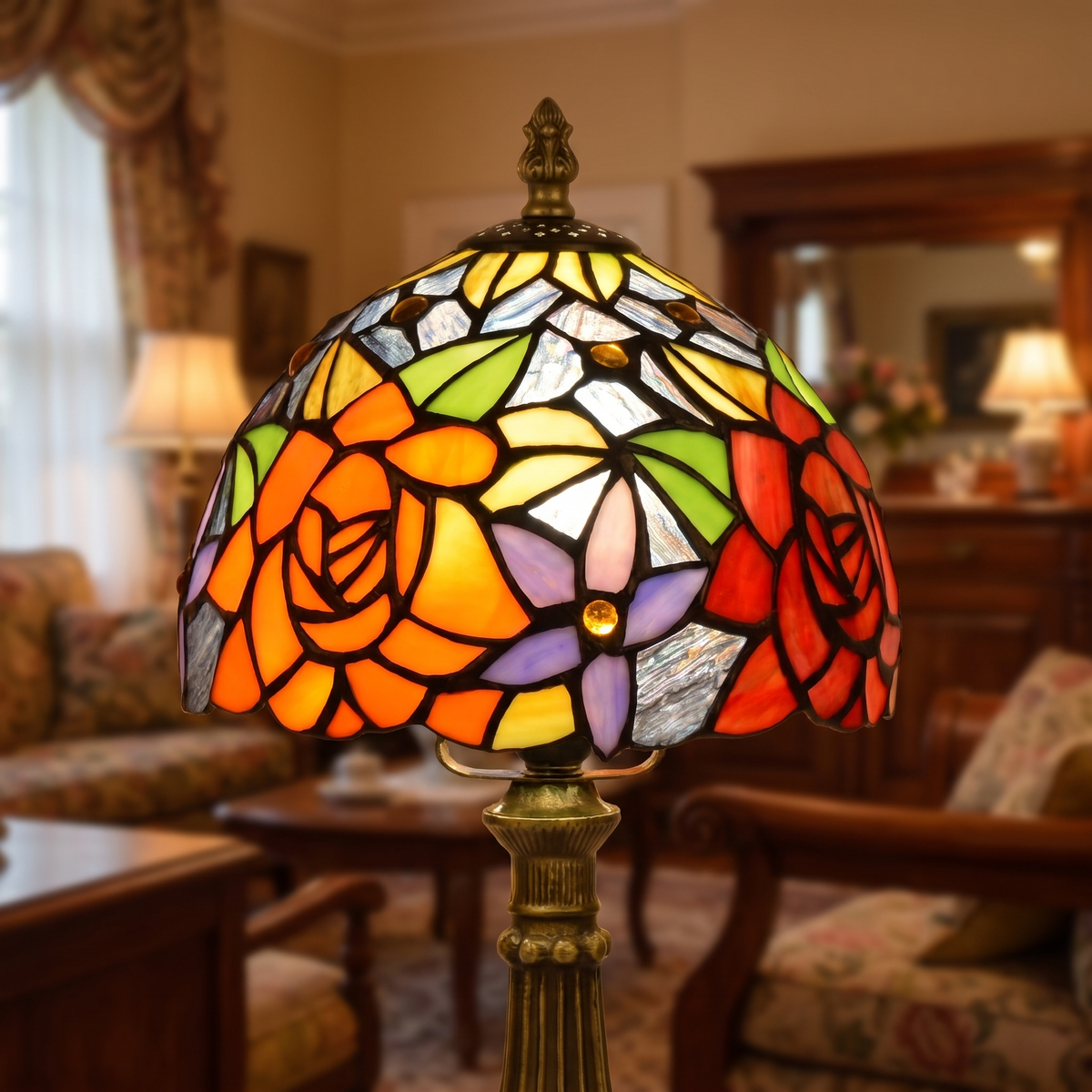 Close up of the lit Hartest shade: orange and red roses, green leaves and violet stars in dark leading
