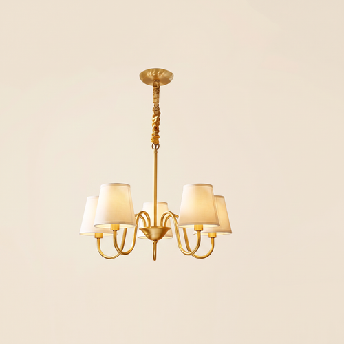 Henham 5 arm brass coloured chandelier with cream linen shades, lit, cream background