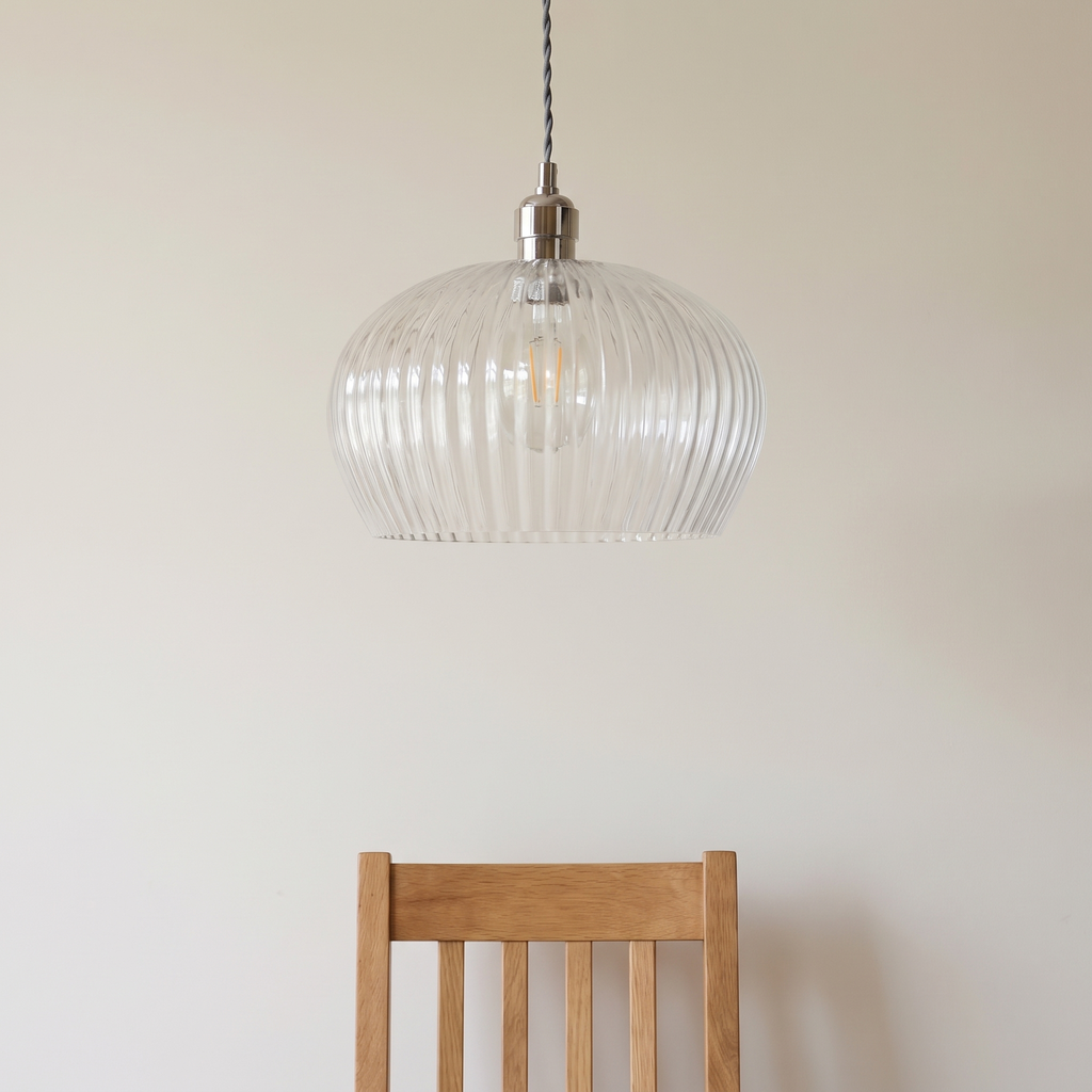Sereno pendant light shown above a dining chair for size reference
