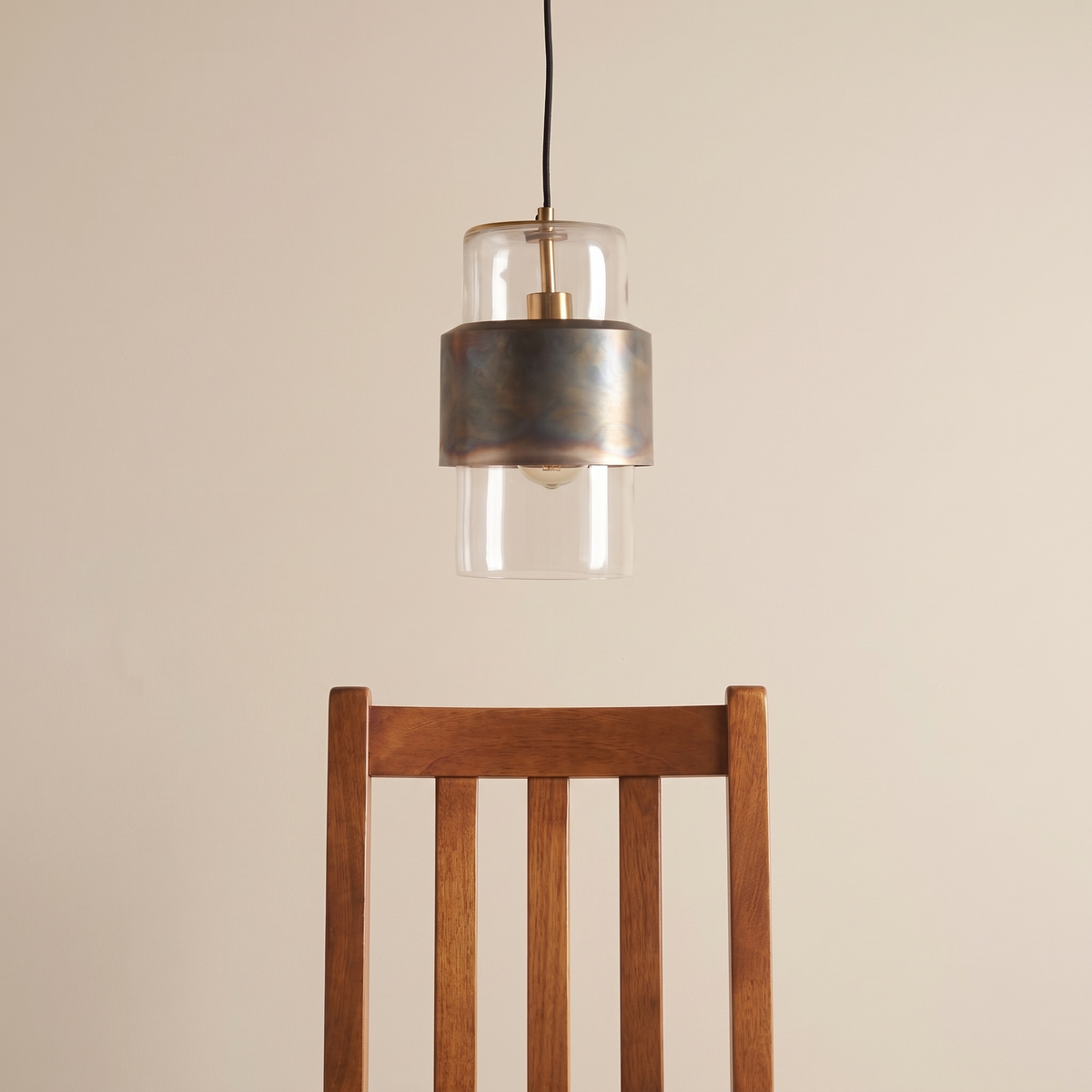 Veniro pendant light shown above a dining chair for size reference