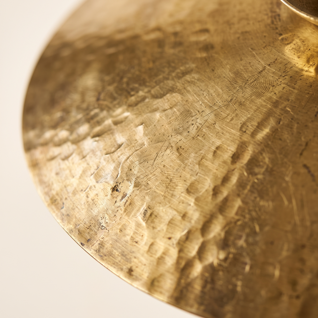 Close detail of the hand hammered brass surface of the Halvern pendant