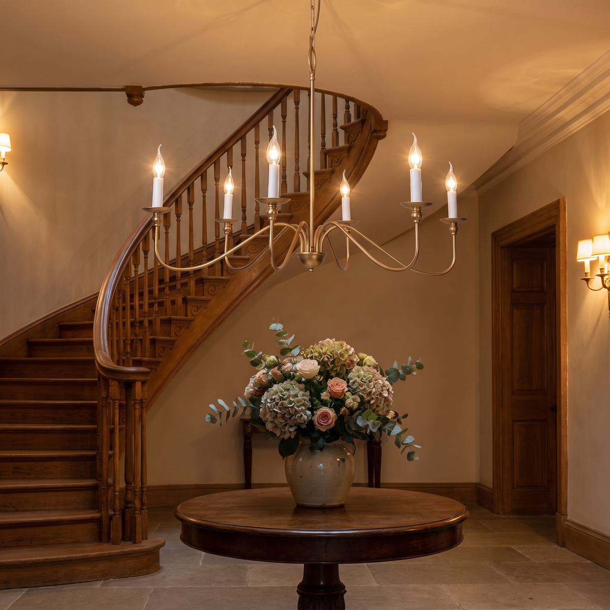 Ashworth chandelier lit in an entrance hall