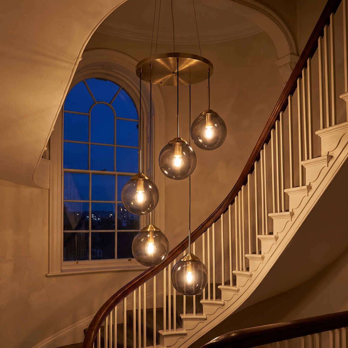 Hartley chandelier lit in a Georgian stairwell
