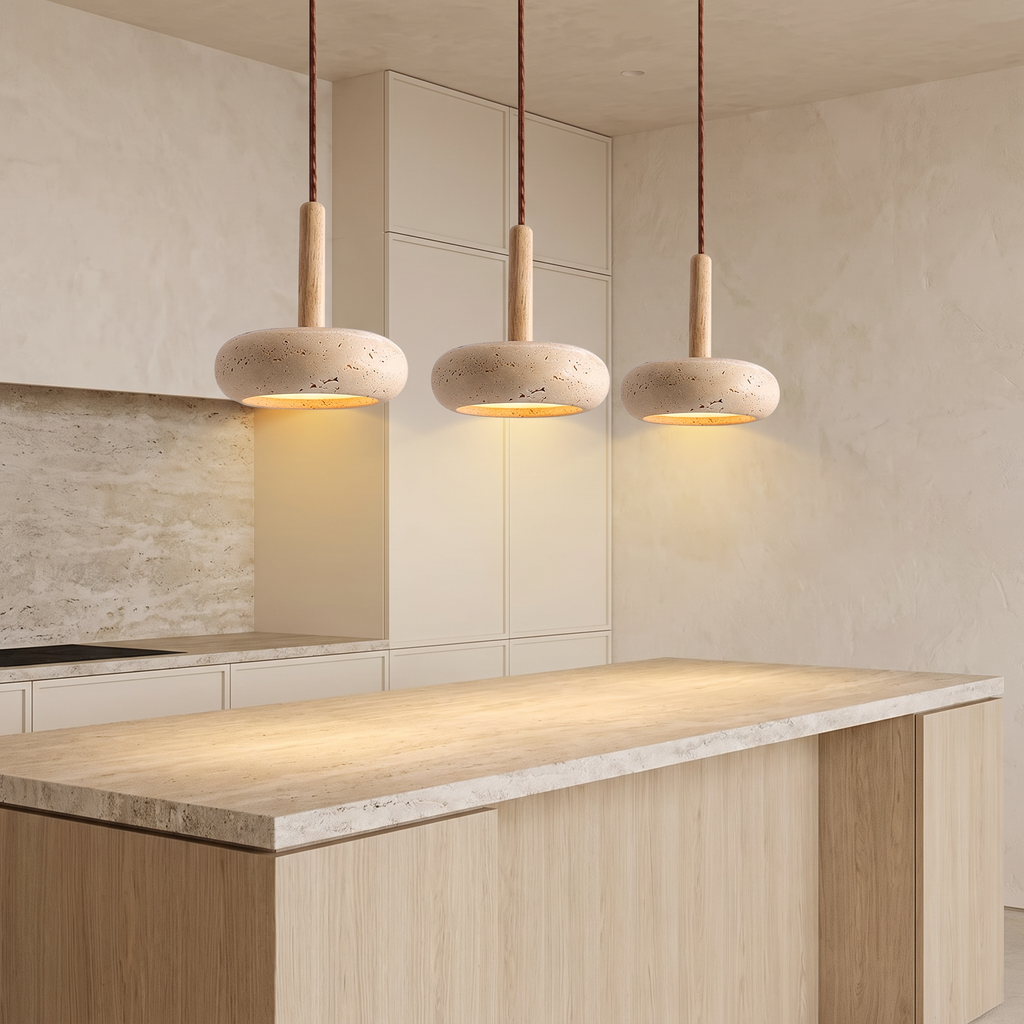 Three Siena travertine pendants over a kitchen island