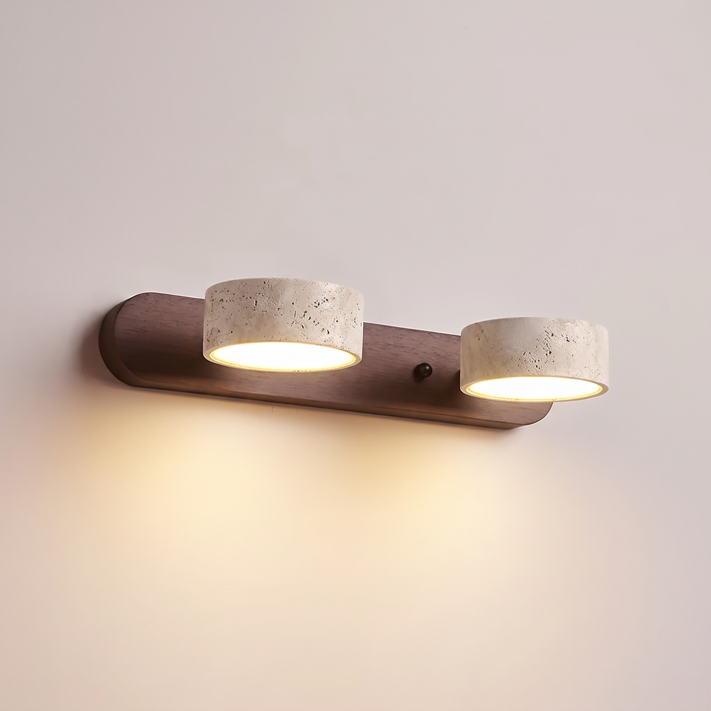 Tivoli duo wall light lit, casting a warm wash down the wall