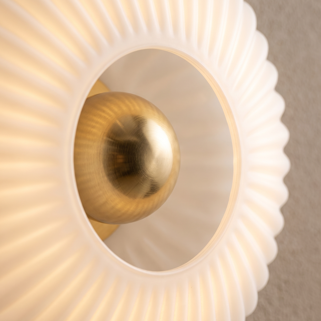 Close up of the pleated opal glass and brass centre