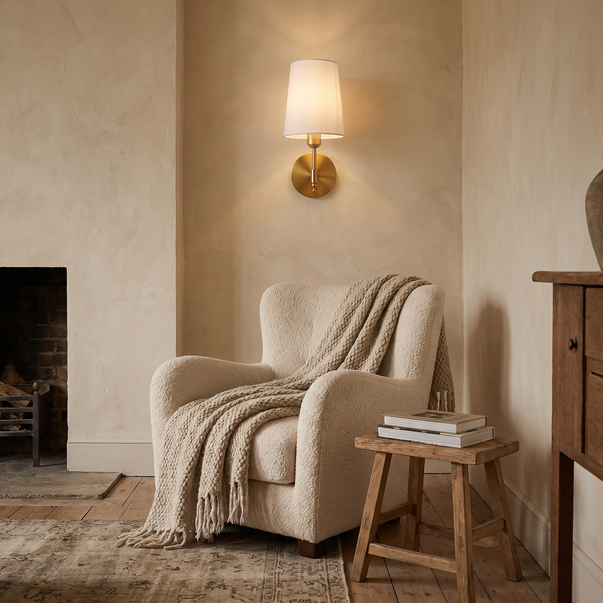 Hollis rechargeable wall light beside a reading chair