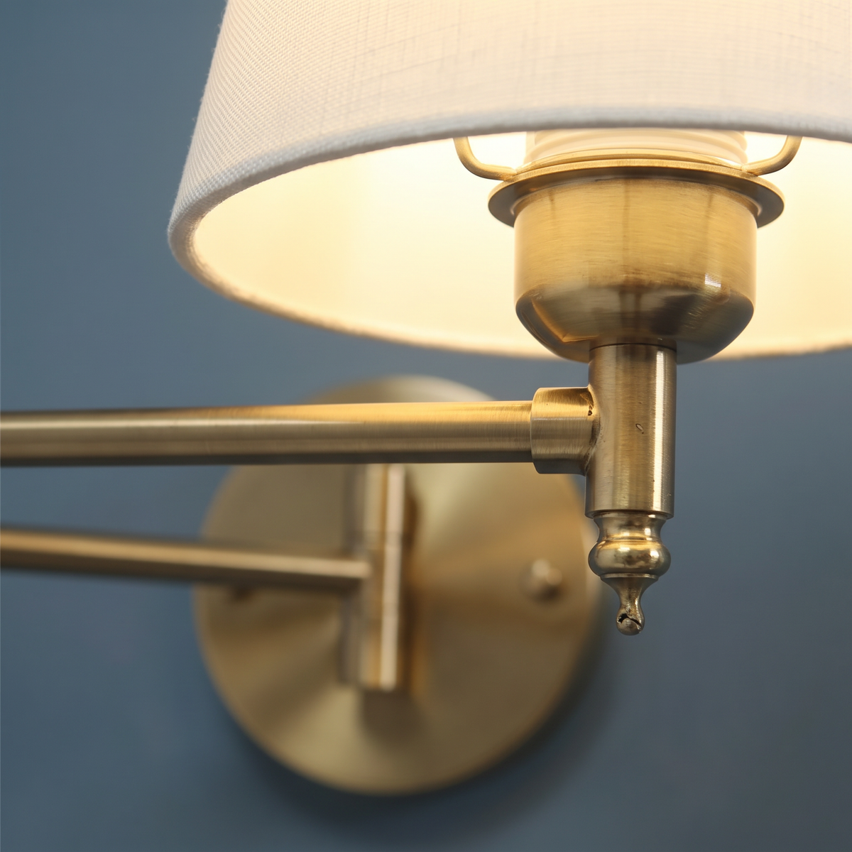 Close up of the brass folding arm and lamp holder