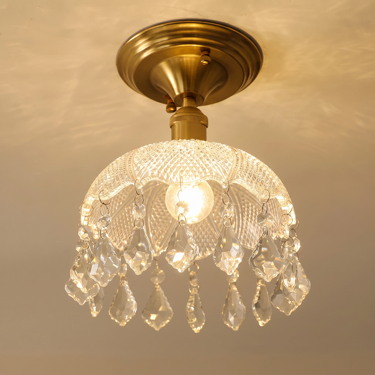 Close up of the Kersey faceted crystal drops and cut glass dome, lit