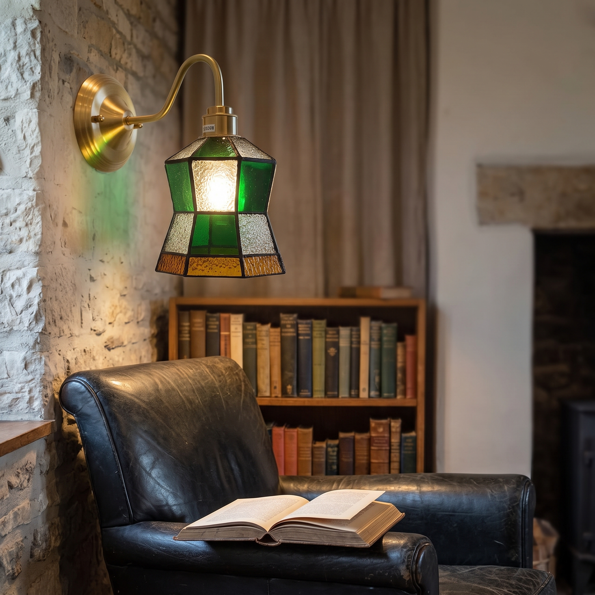 Walberswick stained glass wall light lit beside a leather armchair in a cottage reading corner