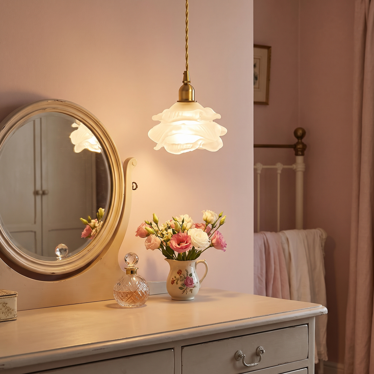 Frosted Thorpeness rose glass pendant light glowing above a dressing table