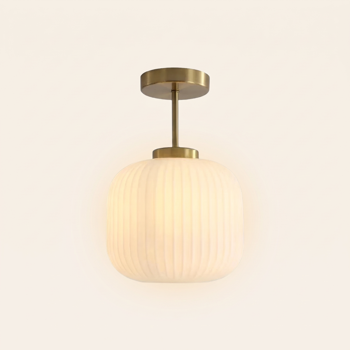 Thornbury ribbed glass semi flush ceiling light in opal, lit, on a cream background