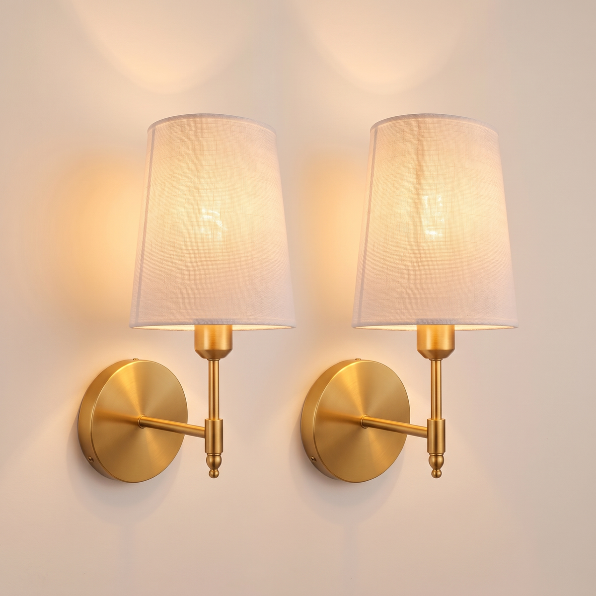 Hollis rechargeable brass wall lights, set of two, lit, linen shades glowing