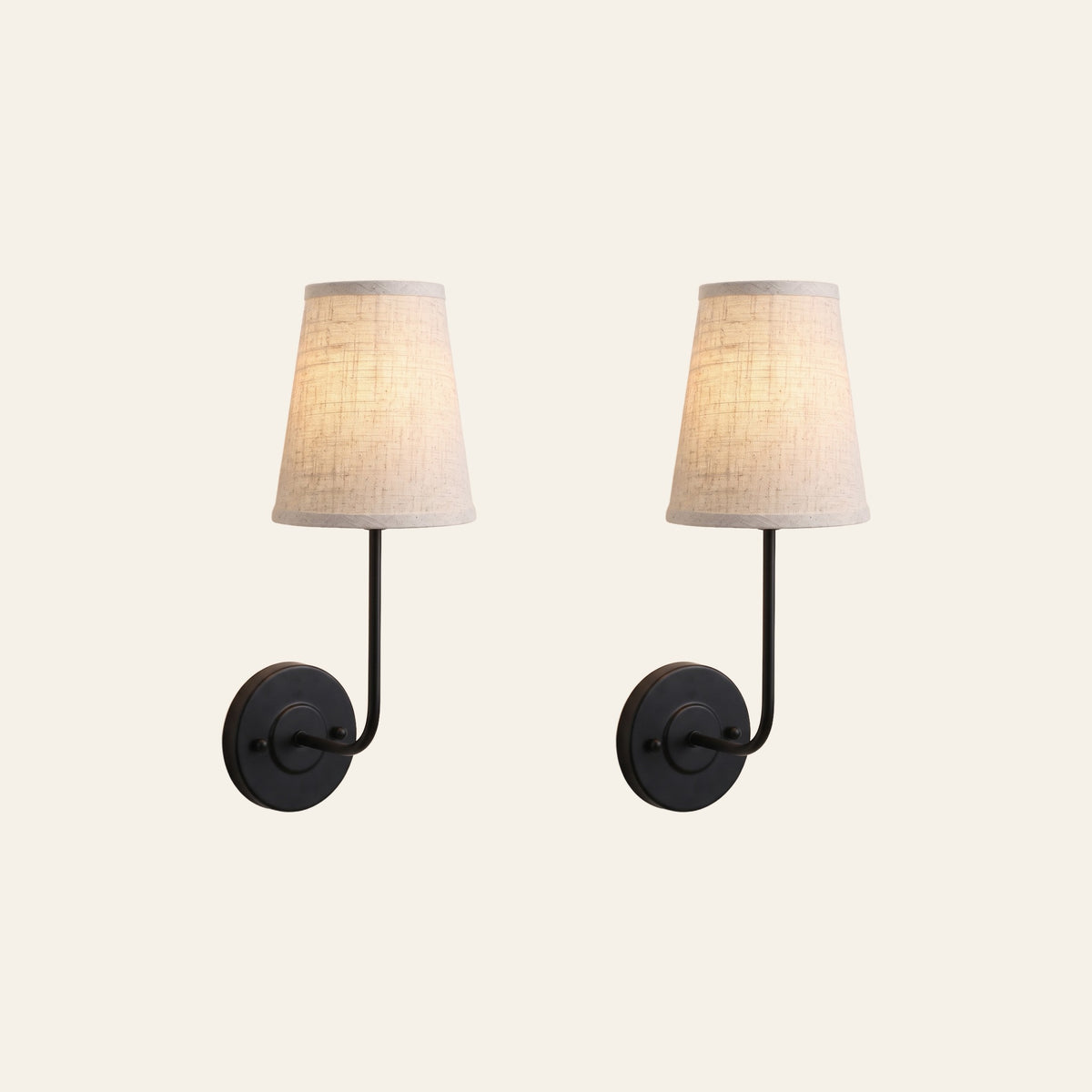 A pair of Hintlesham wall lights in black with linen shades