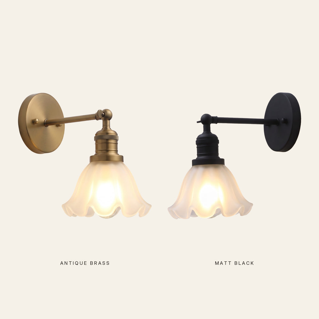 The Hoxne wall light in antique brass and in matt black side by side