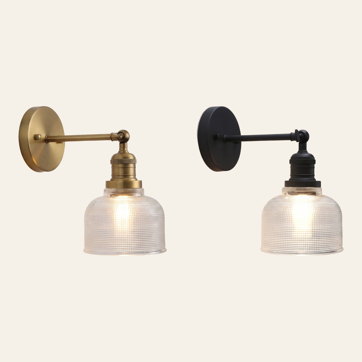 The Ixworth wall light in antique brass and in black side by side