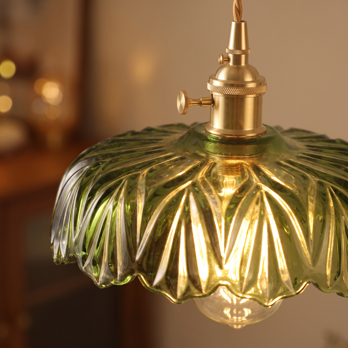 Close up of a lit Kettleburgh shade showing the pressed ribs and ruffled rim
