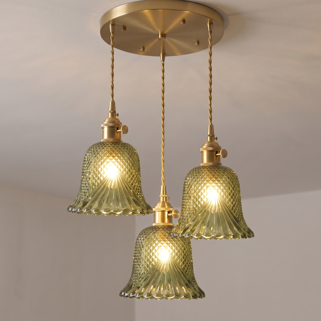 Looking up at the green Lavenham 3 light cluster: the brass ceiling plate, twisted cords and lit cut glass bells