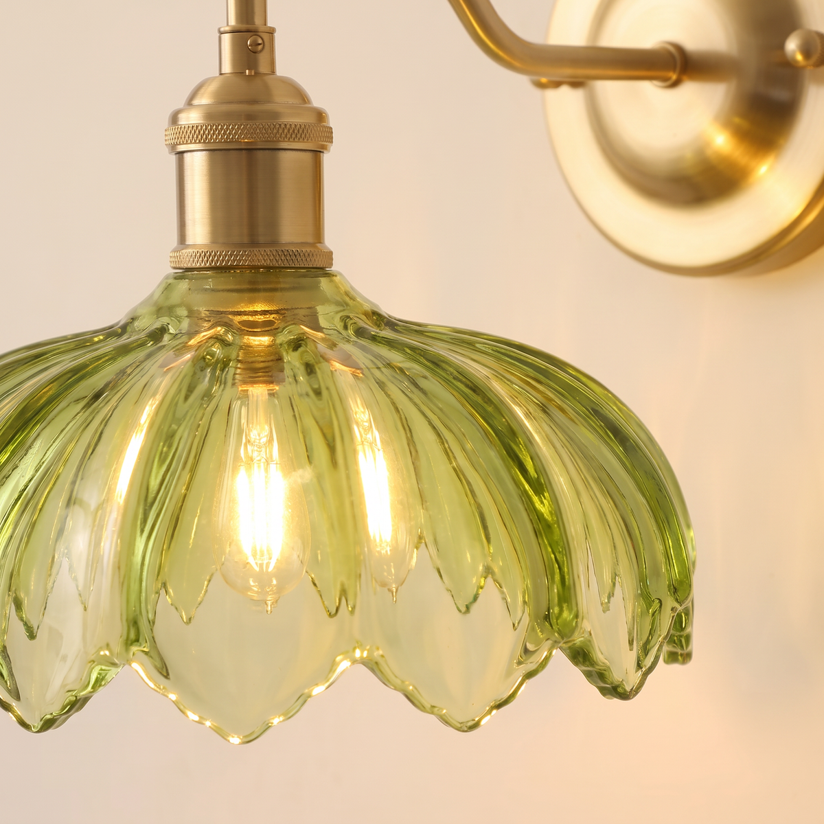 Close up of the Laxfield green ribbed glass shade with its scalloped petal edge