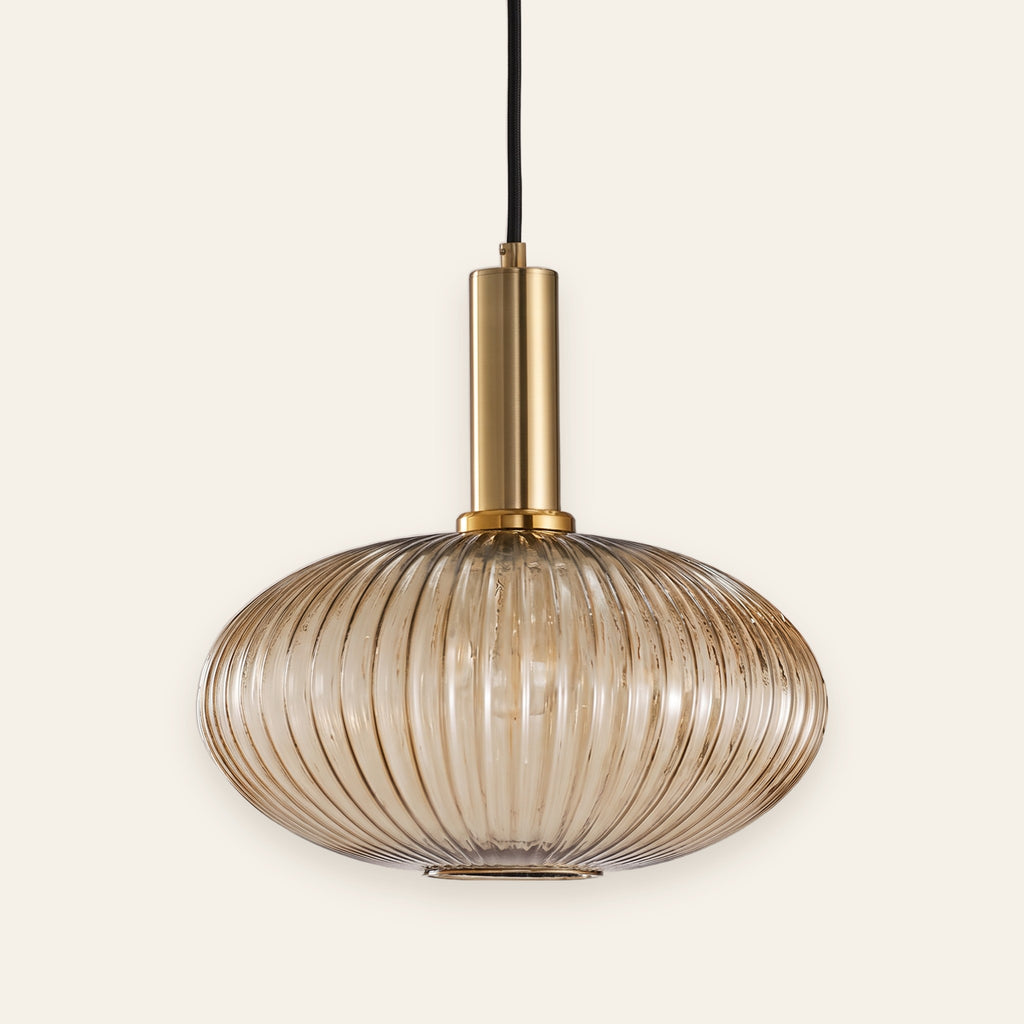 Linley amber ribbed glass pendant with brass cap, cream background