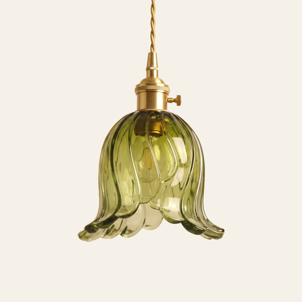 Metfield tulip glass pendant light in green with a brass switch holder and twisted cord, cream background