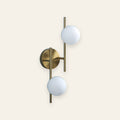 Orsett double opal globe wall light in brushed gold, cream background