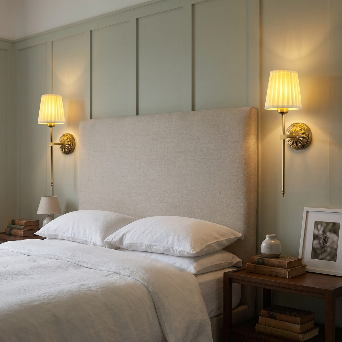 A pair of lit Palgrave rechargeable wall lights either side of a linen headboard in a period bedroom