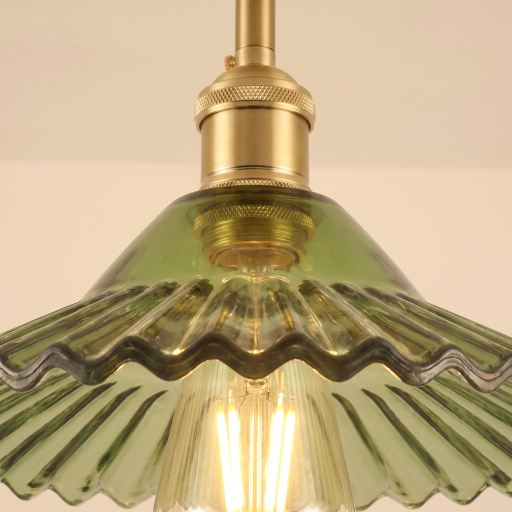 Close up of the Peasenhall green pleated glass cone shade and exposed filament bulb