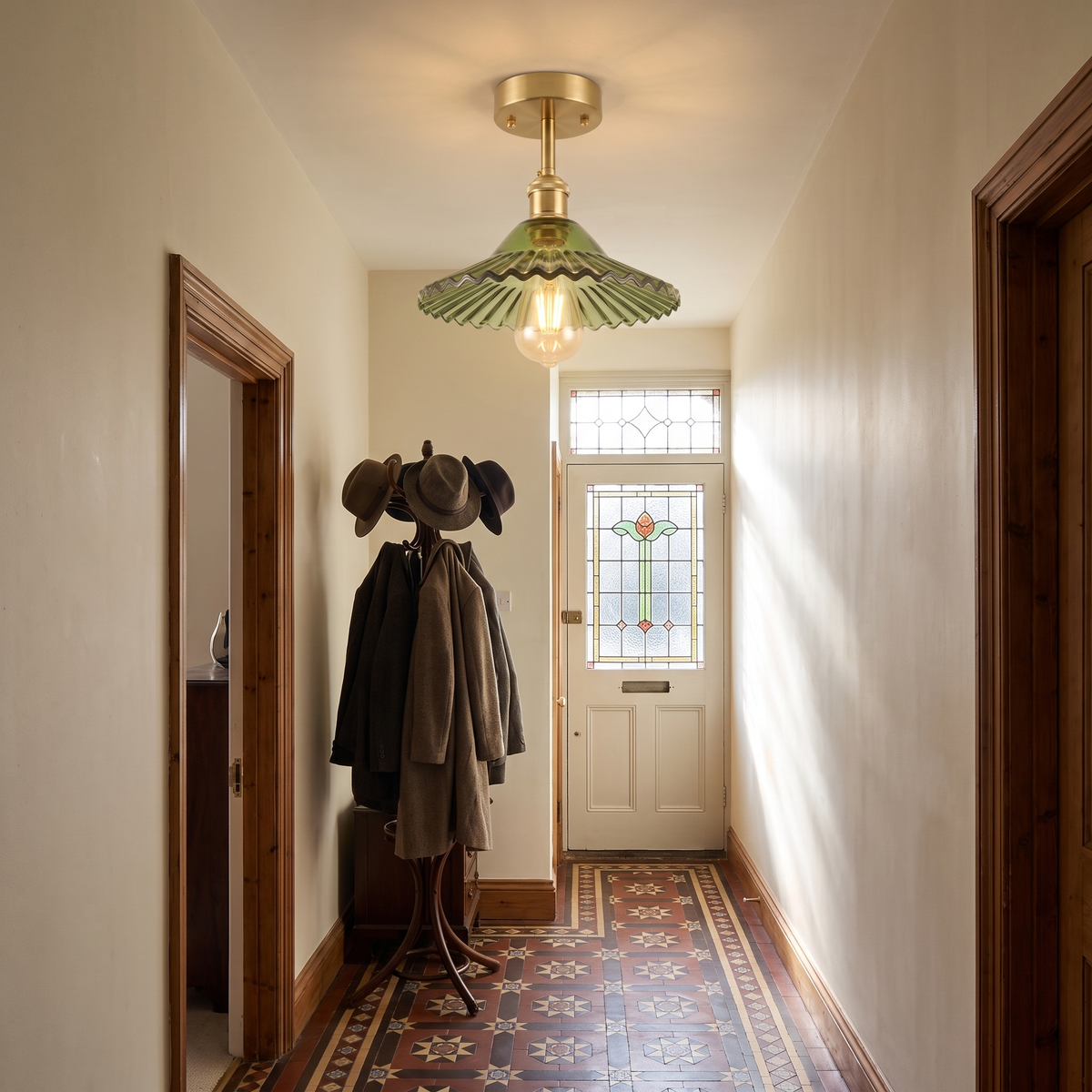 Peasenhall green pleated glass ceiling light in a Victorian tiled hallway