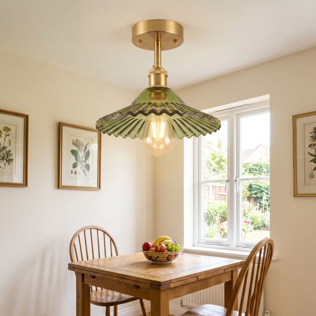 Peasenhall green pleated glass ceiling light above a breakfast table in a kitchen