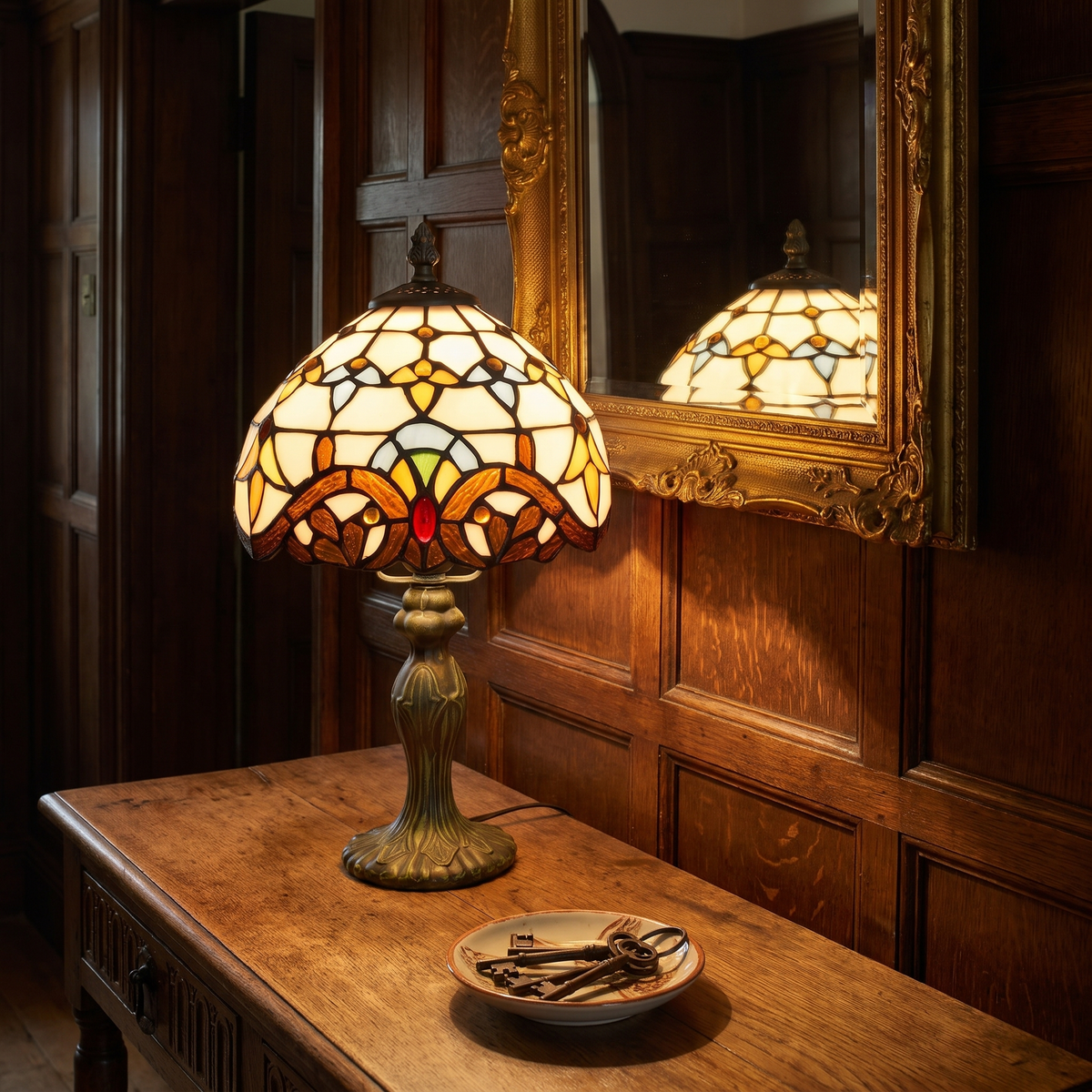 Polstead baroque stained glass lamp lit on a hall table below a mirror