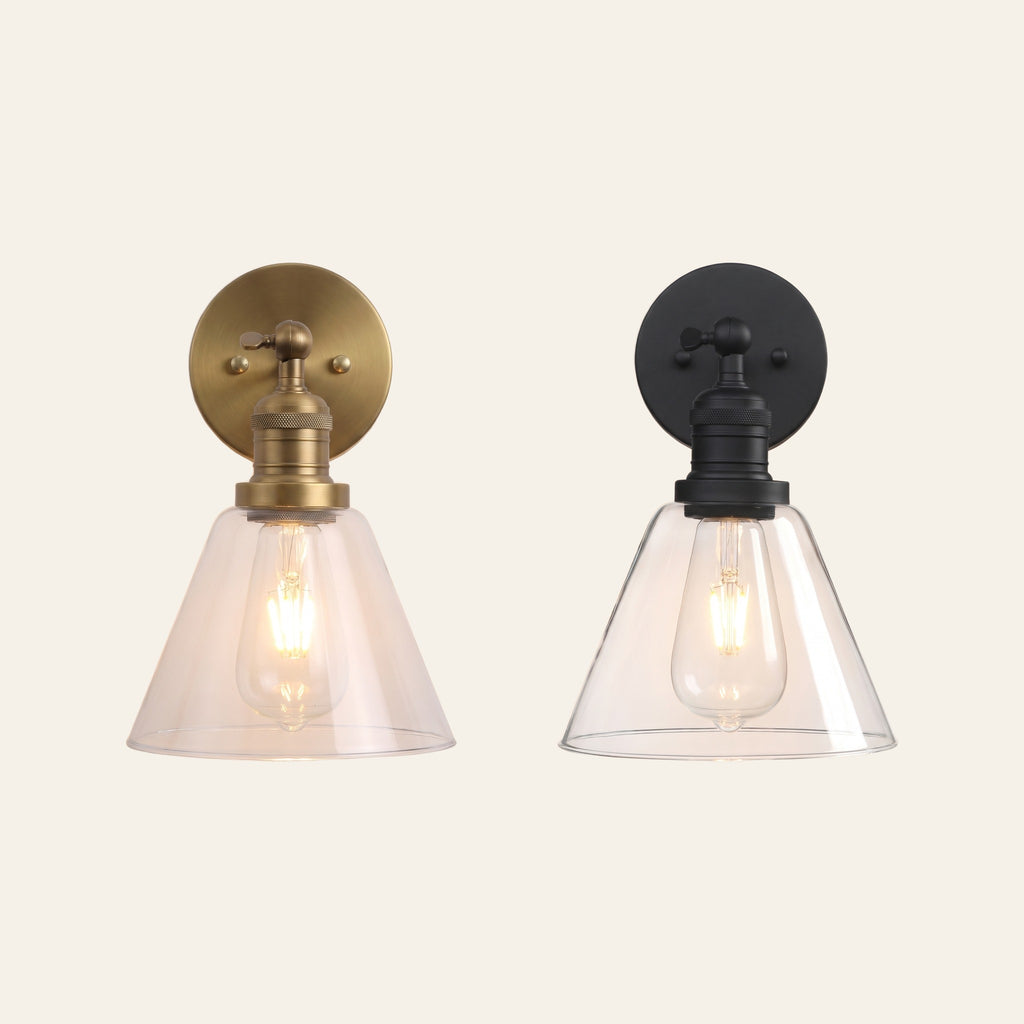 The Shotley wall light in antique brass and in black side by side